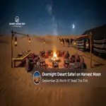 Travellers enjoying an overnight desert safari beneath the September Harvest Moon.