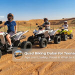 Teenagers enjoying an adventurous quad biking ride across the sandy dunes of Dubai.